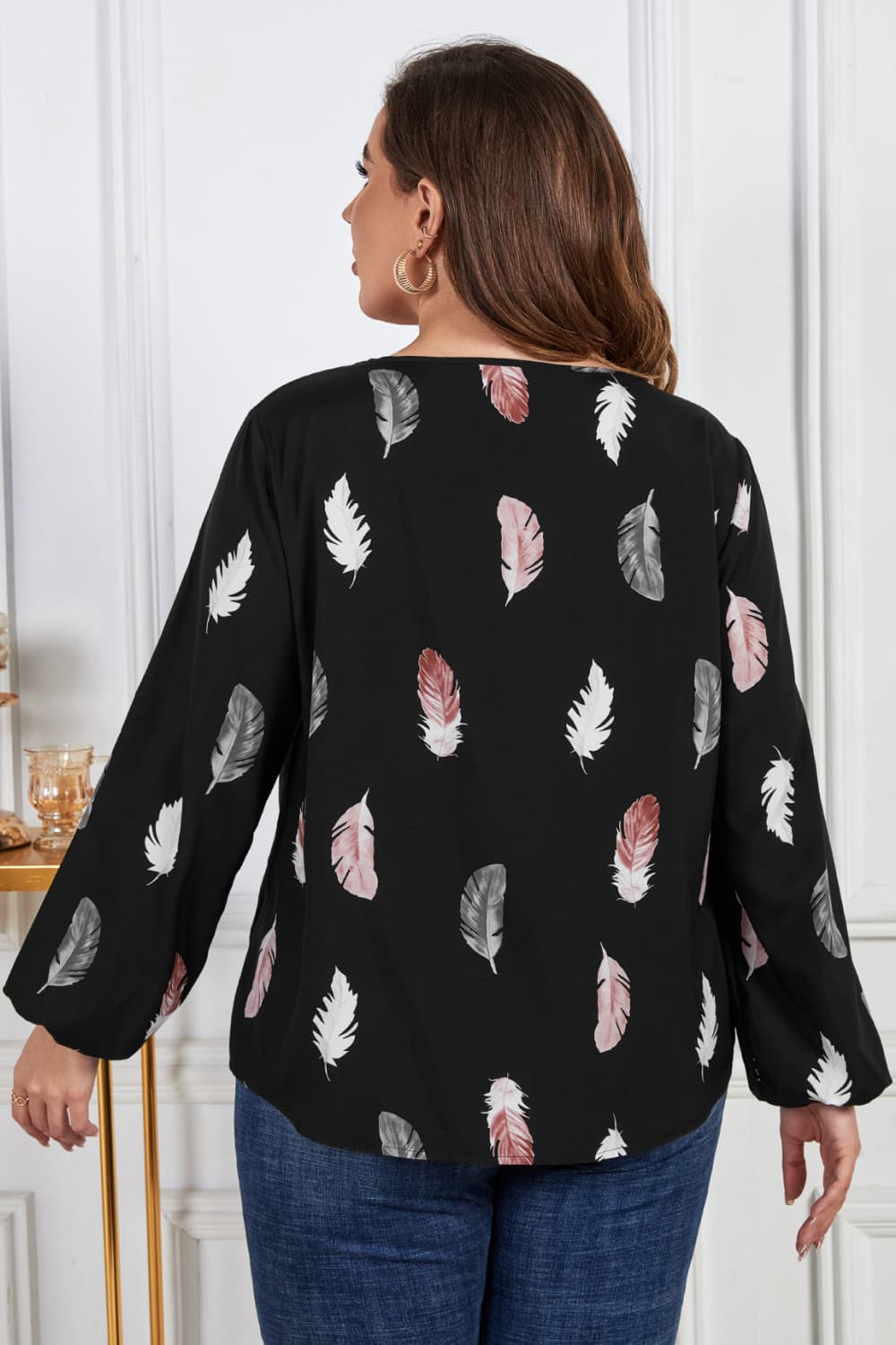 Melo Apparel Plus Size Printed Round Neck Long Sleeve Cutout Blouse